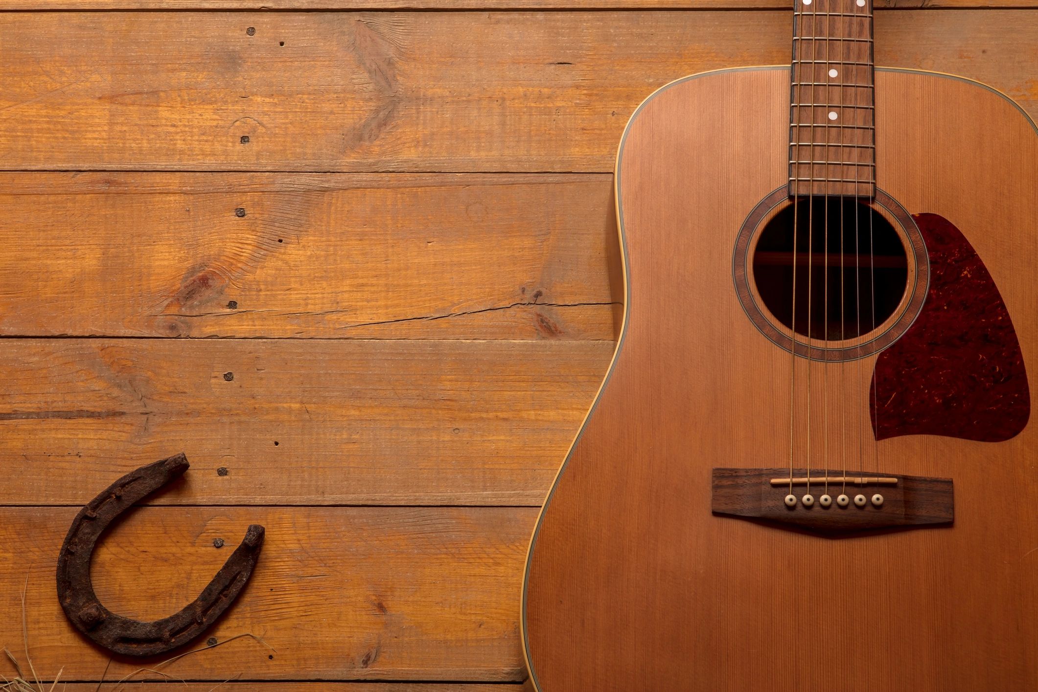 Acoustic guitar on rustic wooden boards