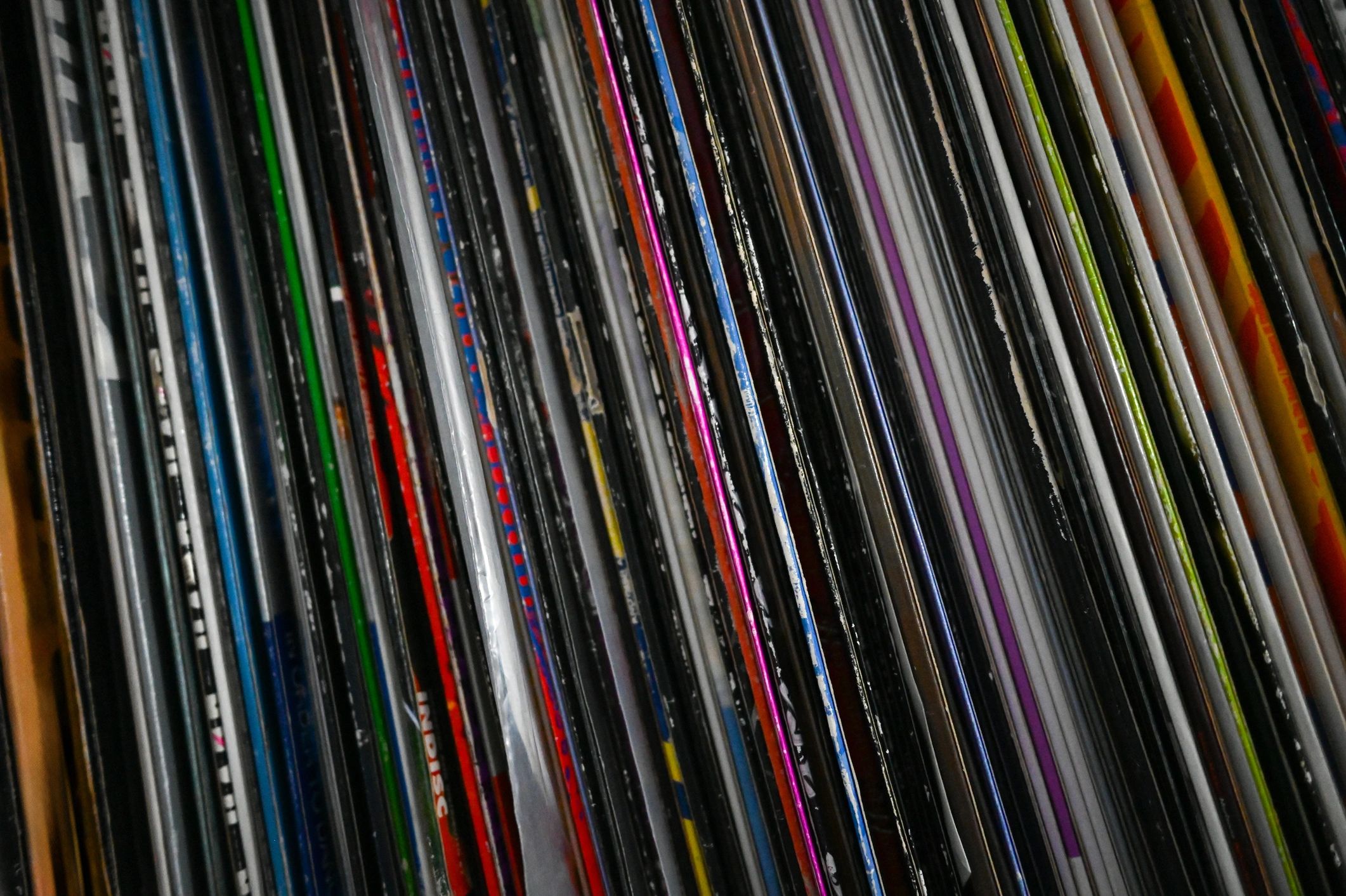 Vintage vinyl records lined up on a shelf